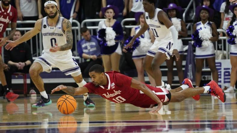 Feb 7, 2024; Evanston, Illinois, USA; Nebraska Cornhuskers guard Jamarques Lawrence (10) dives for a loose ball against the Northwestern Wildcats during the second half at Welsh-Ryan Arena. Mandatory Credit: David Banks-USA TODAY Sports