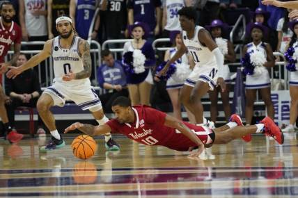 Feb 7, 2024; Evanston, Illinois, USA; Nebraska Cornhuskers guard Jamarques Lawrence (10) dives for a loose ball against the Northwestern Wildcats during the second half at Welsh-Ryan Arena. Mandatory Credit: David Banks-USA TODAY Sports