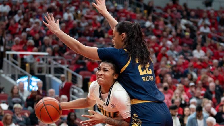 Louisville Cardinals forward Nyla Harris (2) attempts to get around Notre Dame Fighting Irish forward Kylee Watson (22) for a layup during their game on Thursday, Feb. 8, 2024 at KFC YUM Center.