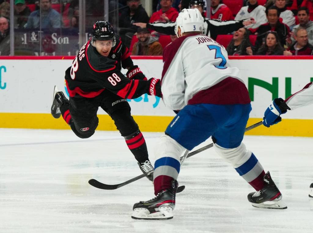 Feb 8, 2024; Raleigh, North Carolina, USA; Carolina Hurricanes center Martin Necas (88) scores a goal against the Colorado Avalanche during the first period at PNC Arena. Mandatory Credit: James Guillory-USA TODAY Sports