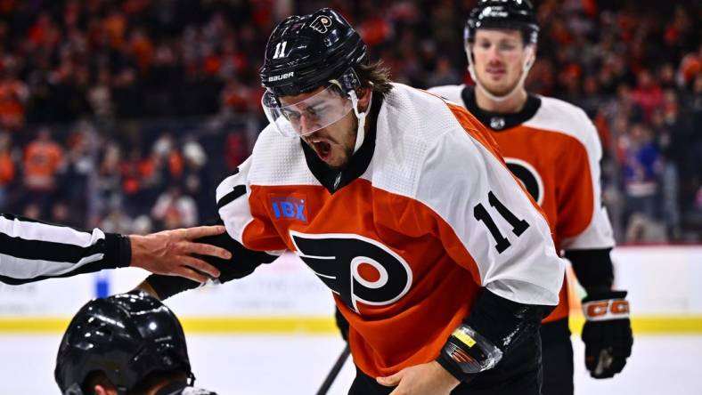 Feb 8, 2024; Philadelphia, Pennsylvania, USA; Philadelphia Flyers right wing Travis Konecny (11) reacts after a fight against Winnipeg Jets defenseman Neal Pionk (4) in the first period at Wells Fargo Center. Mandatory Credit: Kyle Ross-USA TODAY Sports