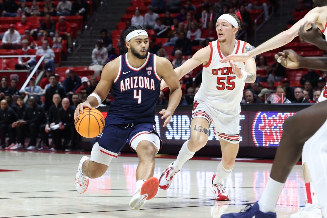 Feb 8, 2024; Salt Lake City, Utah, USA; Arizona Wildcats guard Kylan Boswell (4) brings the ball up the court against Utah Utes guard Gabe Madsen (55) during the first half at Jon M. Huntsman Center. Mandatory Credit: Rob Gray-USA TODAY Sports