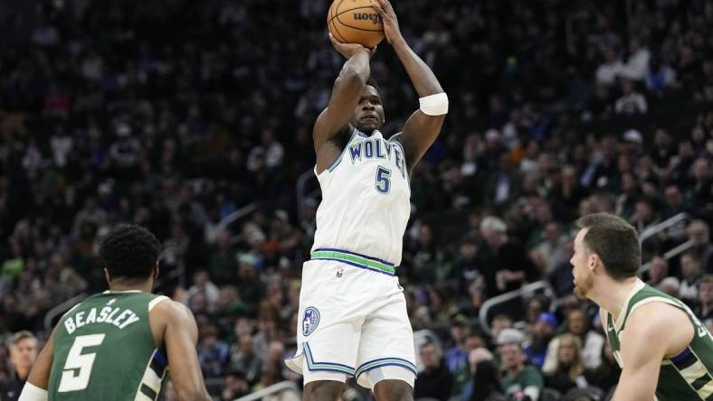 Feb 8, 2024; Milwaukee, Wisconsin, USA;  Minnesota Timberwolves guard Anthony Edwards (5) shoots during the second quarter against the Milwaukee Bucks at Fiserv Forum. Mandatory Credit: Jeff Hanisch-USA TODAY Sports