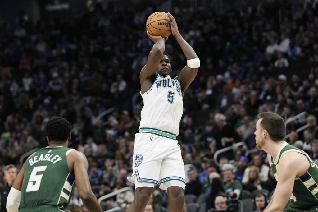 Feb 8, 2024; Milwaukee, Wisconsin, USA;  Minnesota Timberwolves guard Anthony Edwards (5) shoots during the second quarter against the Milwaukee Bucks at Fiserv Forum. Mandatory Credit: Jeff Hanisch-USA TODAY Sports