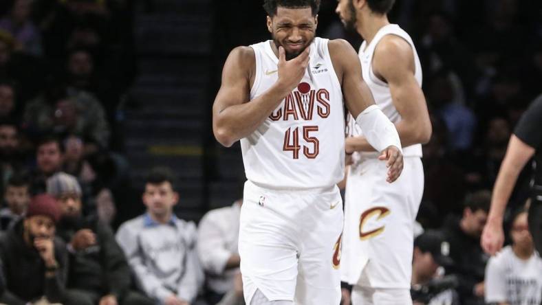 Feb 8, 2024; Brooklyn, New York, USA; Cleveland Cavaliers guard Donovan Mitchell (45) reacts after getting hit in the face in the fourth quarter against the Brooklyn Nets at Barclays Center. Mandatory Credit: Wendell Cruz-USA TODAY Sports