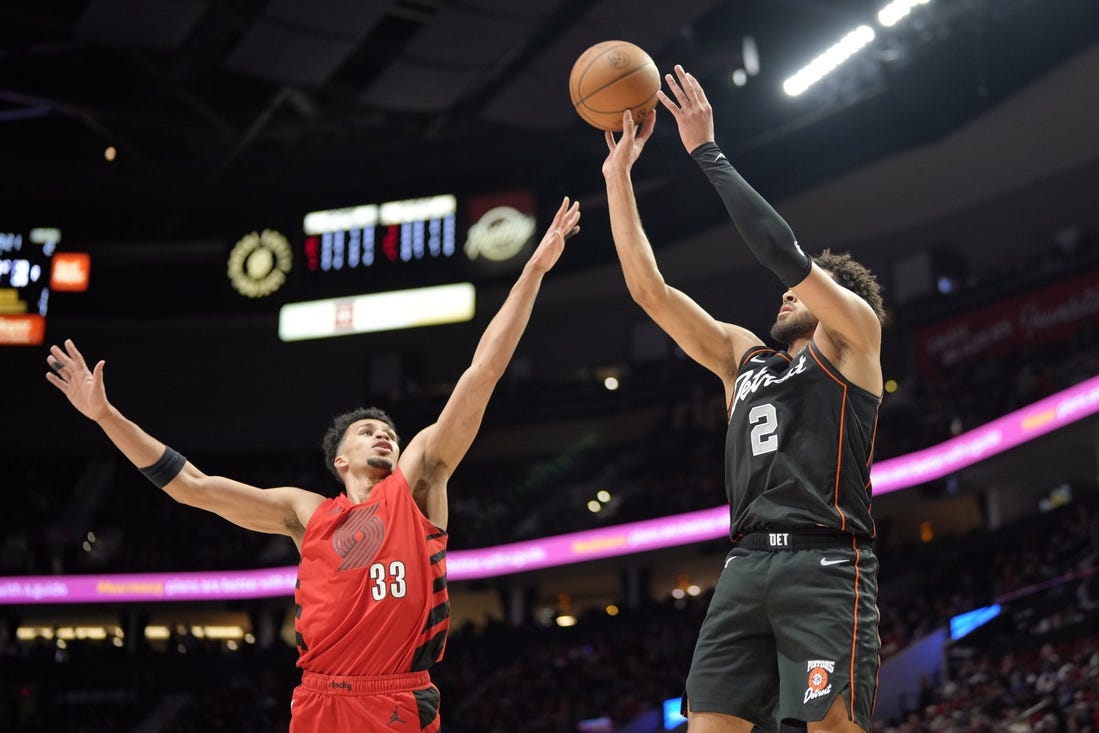 Feb 8, 2024; Portland, Oregon, USA; Detroit Pistons point guard Cade Cunningham (2) shoots the ball over Portland Trail Blazers forward Toumani Camara (33) during the first half at Moda Center. Mandatory Credit: Soobum Im-USA TODAY Sports