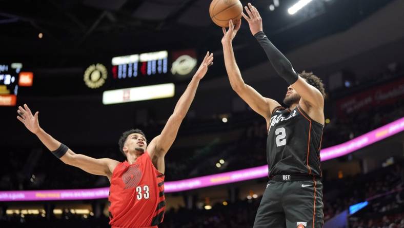 Feb 8, 2024; Portland, Oregon, USA; Detroit Pistons point guard Cade Cunningham (2) shoots the ball over Portland Trail Blazers forward Toumani Camara (33) during the first half at Moda Center. Mandatory Credit: Soobum Im-USA TODAY Sports