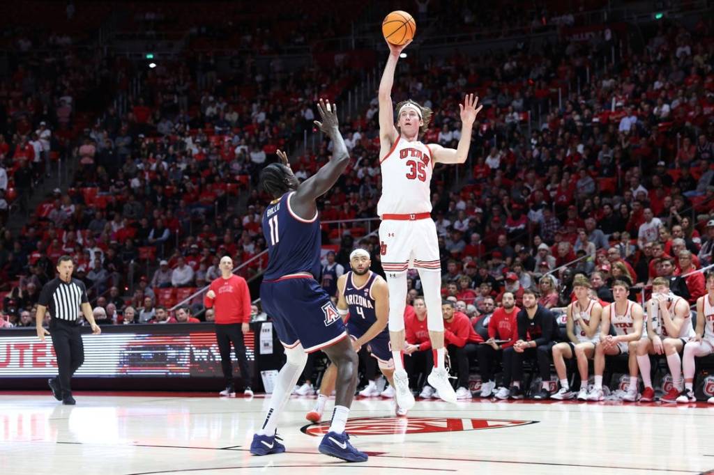 Feb 8, 2024; Salt Lake City, Utah, USA; Utah Utes center Branden Carlson (35) shoots over Arizona Wildcats center Oumar Ballo (11) during second overtime at Jon M. Huntsman Center. Mandatory Credit: Rob Gray-USA TODAY Sports