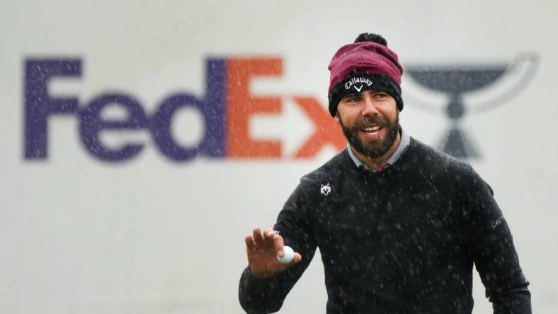 Erik van Rooyen acknowledges the crowd after his birdie putt in the rain on the 16th hole during the 2024 Phoenix Open at TPC Scottsdale on Feb. 8, 2024.