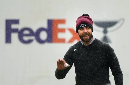 Erik van Rooyen acknowledges the crowd after his birdie putt in the rain on the 16th hole during the 2024 Phoenix Open at TPC Scottsdale on Feb. 8, 2024.