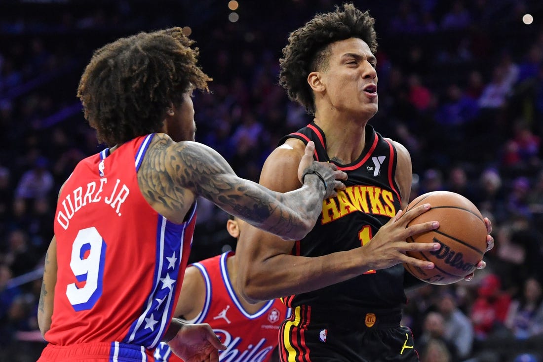 Feb 9, 2024; Philadelphia, Pennsylvania, USA; Atlanta Hawks forward Jalen Johnson (1) drives past Philadelphia 76ers guard Kelly Oubre Jr. (9) during the first quarter at Wells Fargo Center. Mandatory Credit: Eric Hartline-USA TODAY Sports