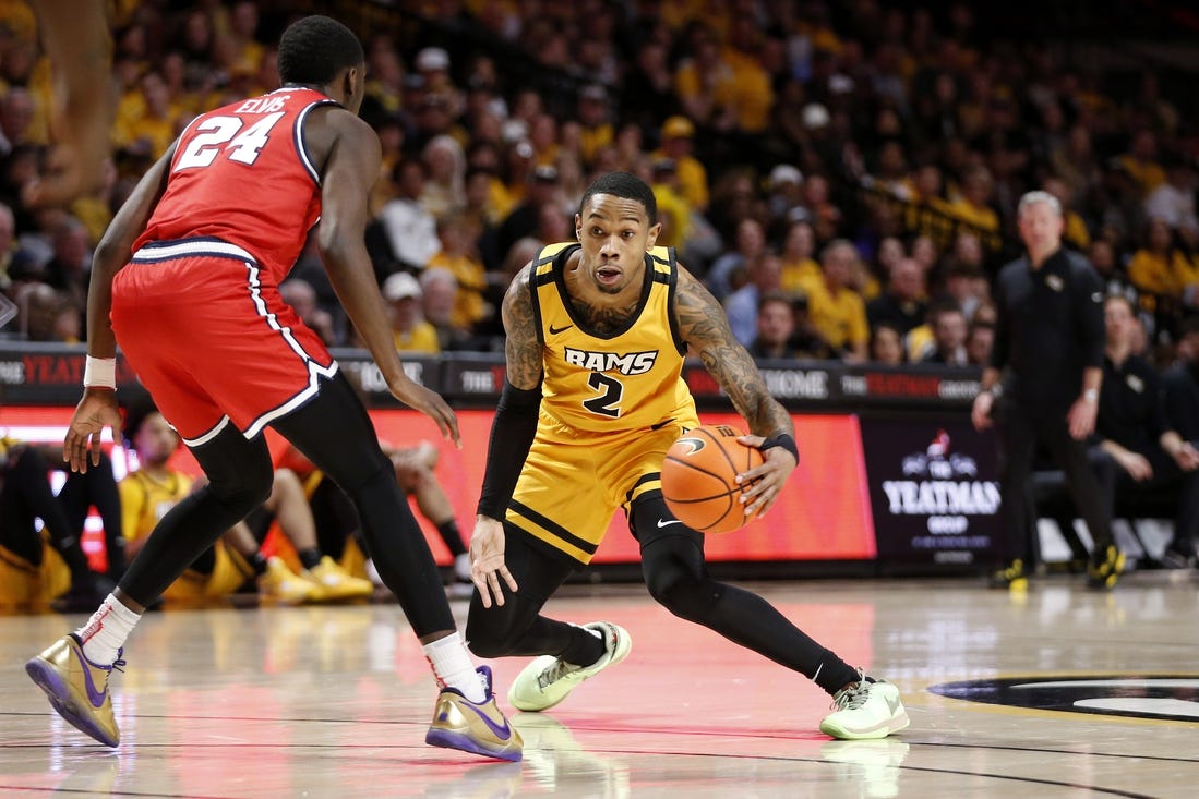 Feb 9, 2024; Richmond, Virginia, USA; Virginia Commonwealth Rams guard Zeb Jackson (2) dribbles the ball as Dayton Flyers guard Kobe Elvis (24) defends during the first half at Stuart C. Siegel Center. Mandatory Credit: Amber Searls-USA TODAY Sports