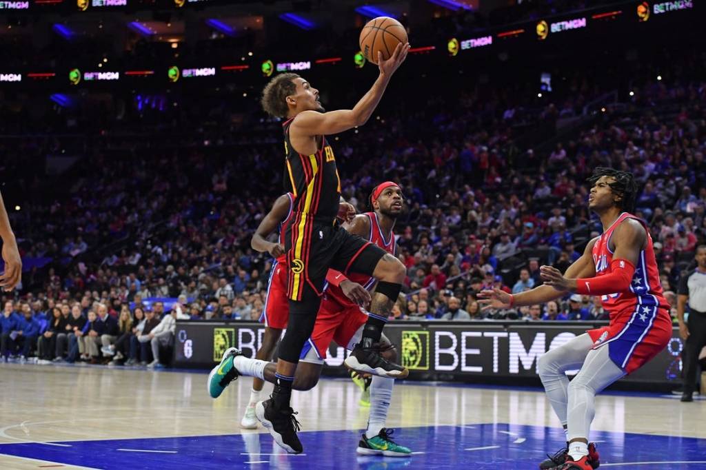 Feb 9, 2024; Philadelphia, Pennsylvania, USA; Atlanta Hawks guard Trae Young (11) drives to the basket past Philadelphia 76ers guard Buddy Hield (17) during the second quarter at Wells Fargo Center. Mandatory Credit: Eric Hartline-USA TODAY Sports