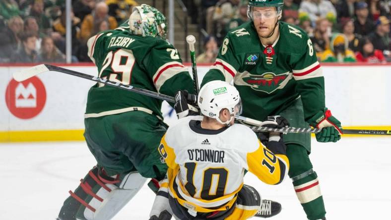 Feb 9, 2024; Saint Paul, Minnesota, USA; Minnesota Wild defenseman Dakota Mermis (6) is called for a penalty on Pittsburgh Penguins left wing Drew O'Connor (10) in the first period at Xcel Energy Center. Mandatory Credit: Matt Blewett-USA TODAY Sports