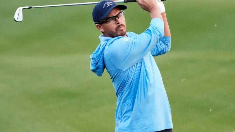 Feb 9, 2024; Scottsdale, AZ, USA; Rickie Fowler plays his second shot on the first hole during Round 2 at the WM Phoenix Open at TPC Scottsdale.