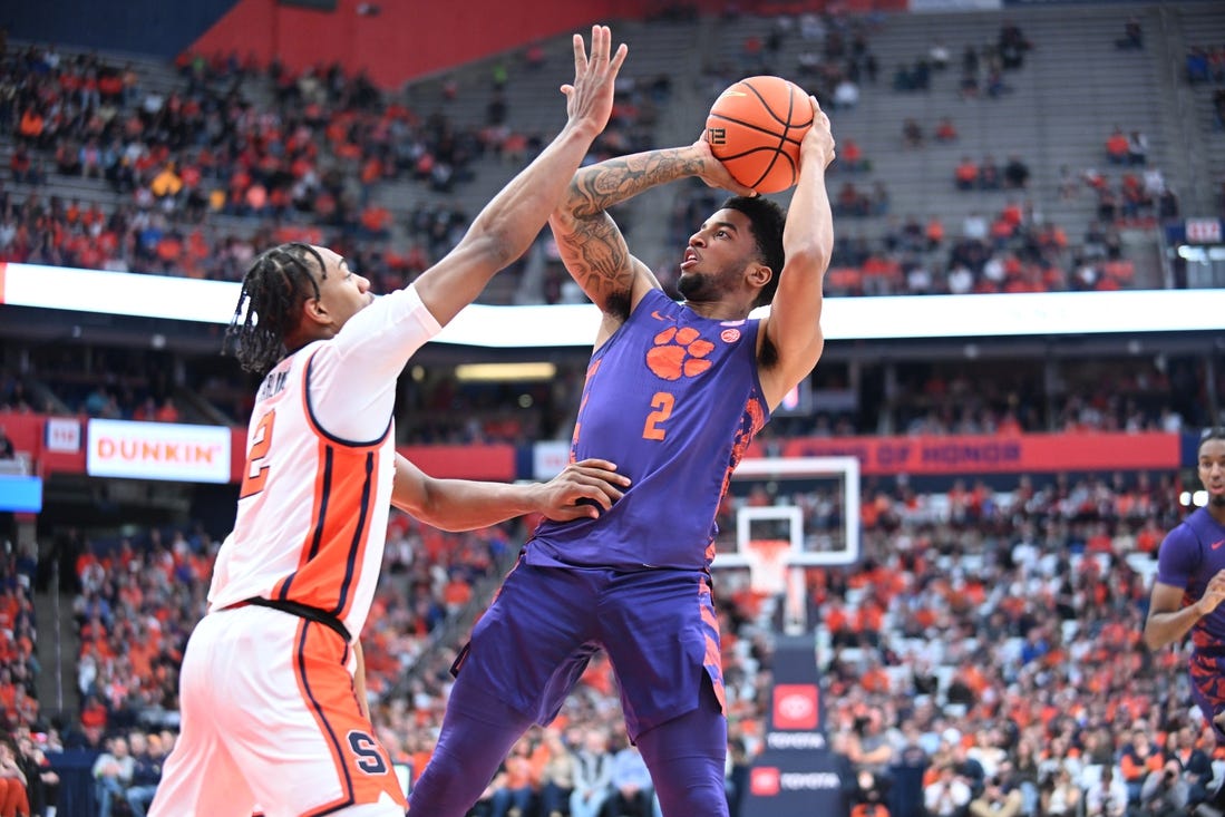 Feb 10, 2024; Syracuse, New York, USA; Clemson Tigers guard Dillon Hunter (2) shoots over Syracuse Orange guard JJ Starling in the first half at the JMA Wireless Dome. Mandatory Credit: Mark Konezny-USA TODAY Sports
