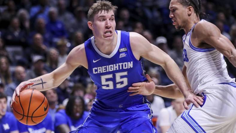 Feb 10, 2024; Cincinnati, Ohio, USA; Creighton Bluejays guard Baylor Scheierman (55) dribbles against Xavier Musketeers guard Desmond Claude (1) in the first half at Cintas Center. Mandatory Credit: Katie Stratman-USA TODAY Sports