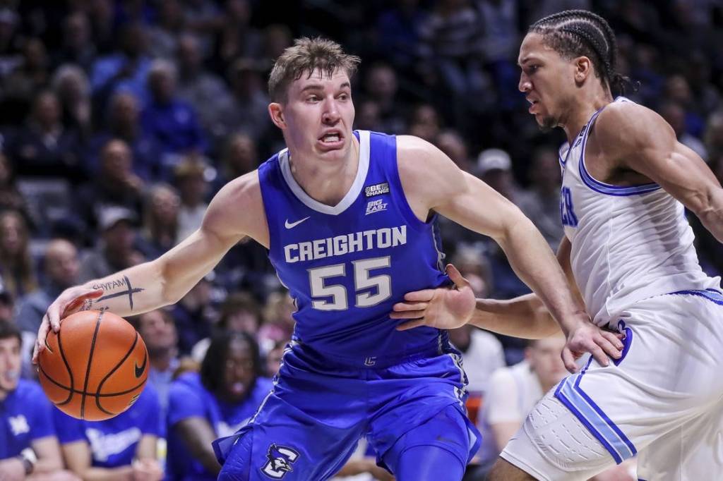 Feb 10, 2024; Cincinnati, Ohio, USA; Creighton Bluejays guard Baylor Scheierman (55) dribbles against Xavier Musketeers guard Desmond Claude (1) in the first half at Cintas Center. Mandatory Credit: Katie Stratman-USA TODAY Sports