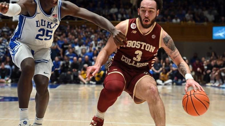 Feb 10, 2024; Durham, North Carolina, USA; Boston College Eagles guard Jaeden Zackery (3) controls the ball against Duke Blue Devils forward Mark Mitchell (25) during the first half  at Cameron Indoor Stadium. Mandatory Credit: Rob Kinnan-USA TODAY Sports