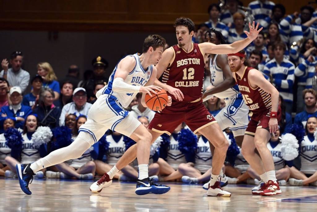 Feb 10, 2024; Durham, North Carolina, USA; Duke Blue Devils center Kyle Filipowski (30) drives to the basket against Boston College Eagles center Quinten Post (12) during the first half  at Cameron Indoor Stadium. Mandatory Credit: Rob Kinnan-USA TODAY Sports