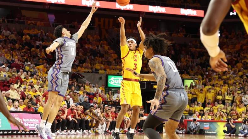 Feb 10, 2024; Ames, Iowa, USA; Iowa State Cyclones guard Tamin Lipsey (3) shoots over TCU Horned Frogs guard Trevian Tennyson (11) during the first half at James H. Hilton Coliseum. Mandatory Credit: Reese Strickland-USA TODAY Sports