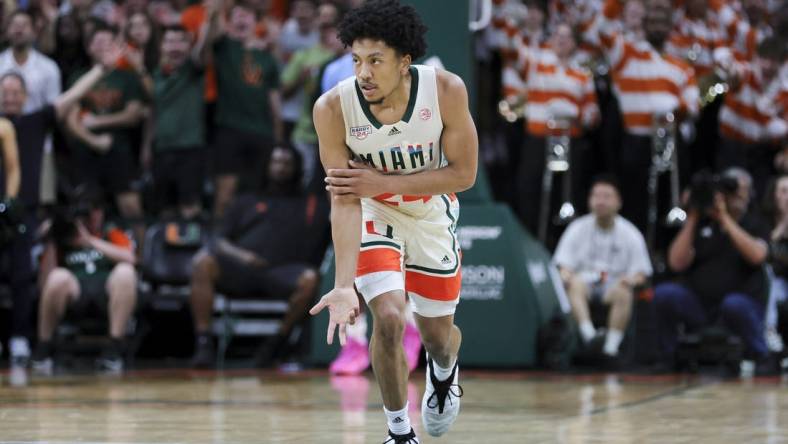 Feb 10, 2024; Coral Gables, Florida, USA; Miami Hurricanes guard Nijel Pack (24) reacts after scoring against the North Carolina Tar Heels during the first half at Watsco Center. Mandatory Credit: Sam Navarro-USA TODAY Sports