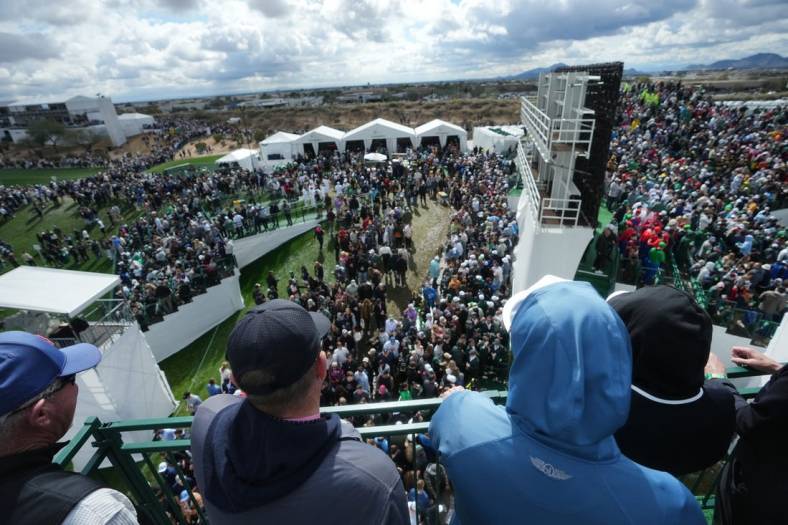 Feb 10, 2024; Scottsdale, AZ, USA; Fans look out from the stands on the 16th hole during the 2024 Phoenix Open at TPC Scottsdale.