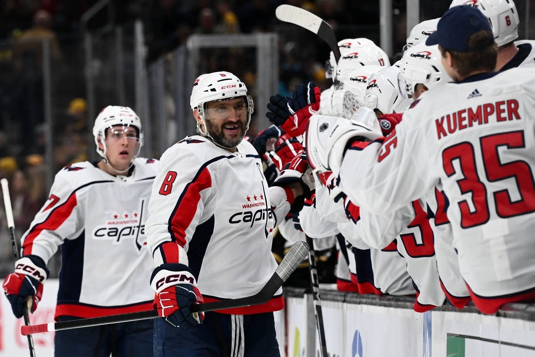 Feb 10, 2024; Boston, Massachusetts, USA; Washington Capitals left wing Alex Ovechkin (8) celebrates with his teammates after scoring a goal against the Boston Bruins during the third period at the TD Garden. Mandatory Credit: Brian Fluharty-USA TODAY Sports