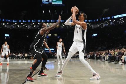 Feb 10, 2024; Brooklyn, New York, USA; San Antonio Spurs center Victor Wembanyama (1) shoots a jump shot against the Brooklyn Nets  during the first quarter at Barclays Center. Mandatory Credit: Gregory Fisher-USA TODAY Sports