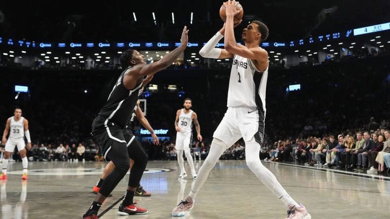 Feb 10, 2024; Brooklyn, New York, USA; San Antonio Spurs center Victor Wembanyama (1) shoots a jump shot against the Brooklyn Nets  during the first quarter at Barclays Center. Mandatory Credit: Gregory Fisher-USA TODAY Sports