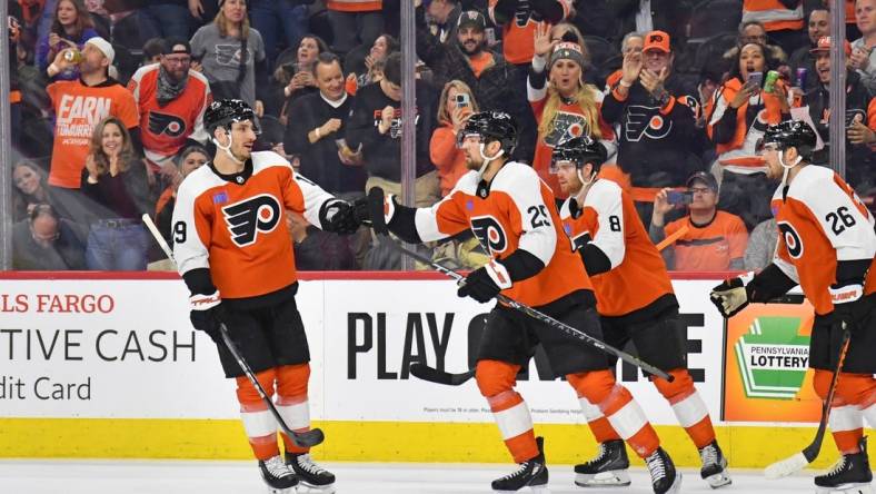 Feb 10, 2024; Philadelphia, Pennsylvania, USA; Philadelphia Flyers center Ryan Poehling (25) celebrates his goal with right wing Garnet Hathaway (19) against the Seattle Kraken during the first period at Wells Fargo Center. Mandatory Credit: Eric Hartline-USA TODAY Sports