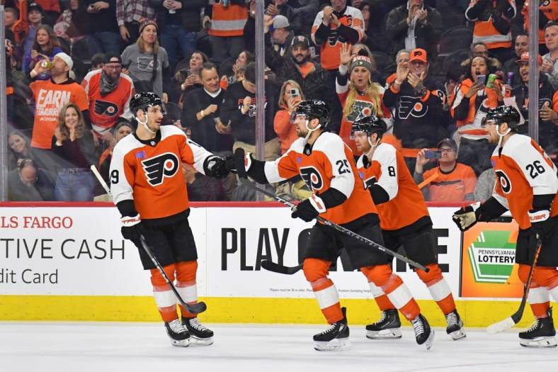 Feb 10, 2024; Philadelphia, Pennsylvania, USA; Philadelphia Flyers center Ryan Poehling (25) celebrates his goal with right wing Garnet Hathaway (19) against the Seattle Kraken during the first period at Wells Fargo Center. Mandatory Credit: Eric Hartline-USA TODAY Sports