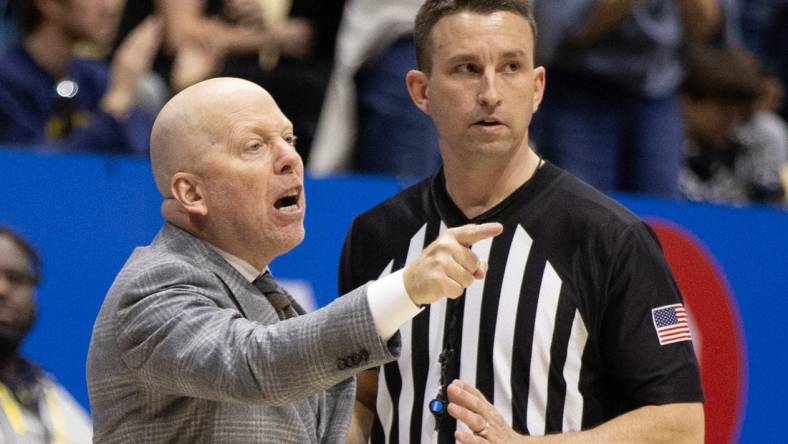 Feb 10, 2024; Berkeley, California, USA; UCLA Bruins head coach Mick Cronin (left) argues a call with a referee during the second half against the California Golden Bears at Haas Pavilion. Mandatory Credit: D. Ross Cameron-USA TODAY Sports