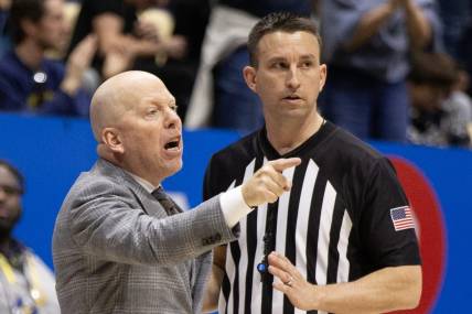 Feb 10, 2024; Berkeley, California, USA; UCLA Bruins head coach Mick Cronin (left) argues a call with a referee during the second half against the California Golden Bears at Haas Pavilion. Mandatory Credit: D. Ross Cameron-USA TODAY Sports