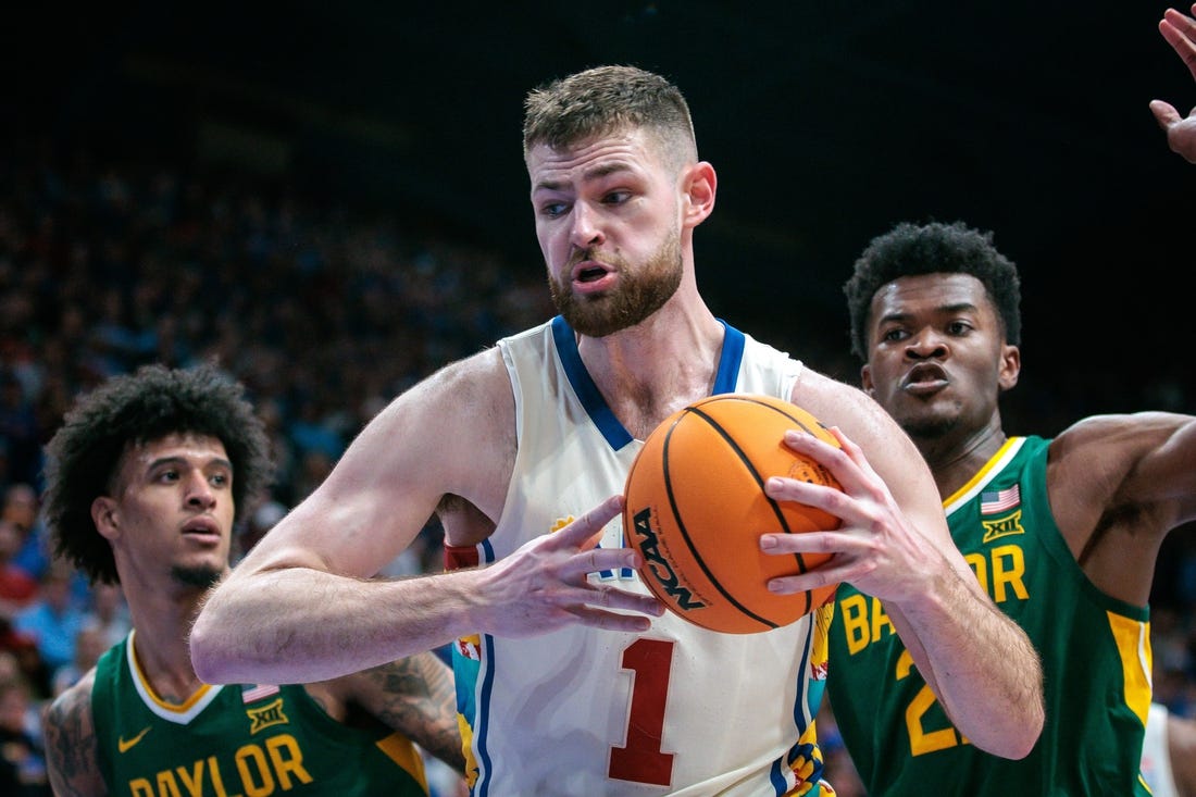 Feb 10, 2024; Lawrence, Kansas, USA; Kansas Jayhawks center Hunter Dickinson (1) protects the ball during the second half against the Baylor Bears at Allen Fieldhouse. Mandatory Credit: William Purnell-USA TODAY Sports