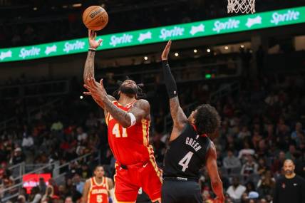 Feb 10, 2024; Atlanta, Georgia, USA; Atlanta Hawks forward Saddiq Bey (41) shoots past Houston Rockets guard Jalen Green (4) in the second quarter at State Farm Arena. Mandatory Credit: Brett Davis-USA TODAY Sports