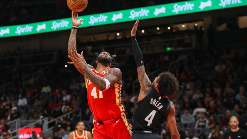 Feb 10, 2024; Atlanta, Georgia, USA; Atlanta Hawks forward Saddiq Bey (41) shoots past Houston Rockets guard Jalen Green (4) in the second quarter at State Farm Arena. Mandatory Credit: Brett Davis-USA TODAY Sports