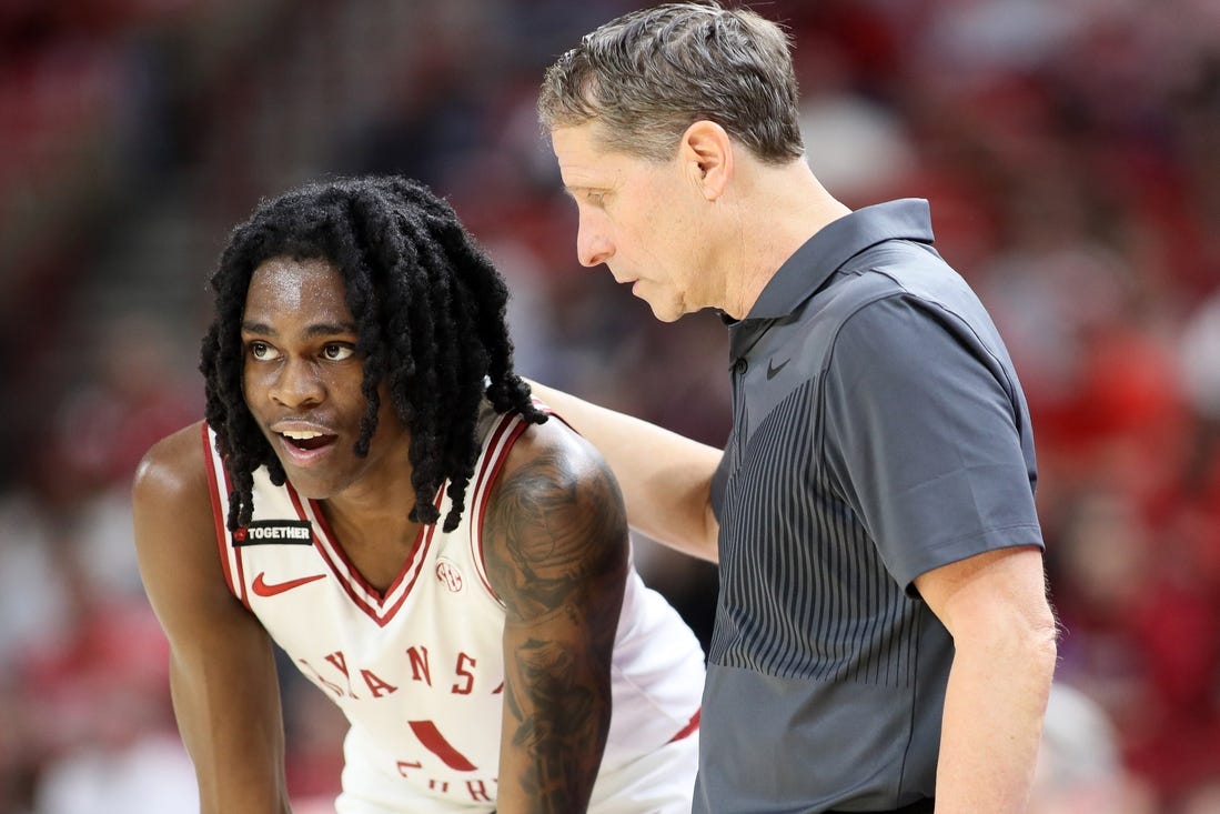 Feb 10, 2024; Fayetteville, Arkansas, USA; Arkansas Razorbacks guard Keyon Menifield Jr (1) talks to head coach Eric Musselman during the second half against the Georgia Bulldogs at Bud Walton Arena. Arkansas won 78-75. Mandatory Credit: Nelson Chenault-USA TODAY Sports