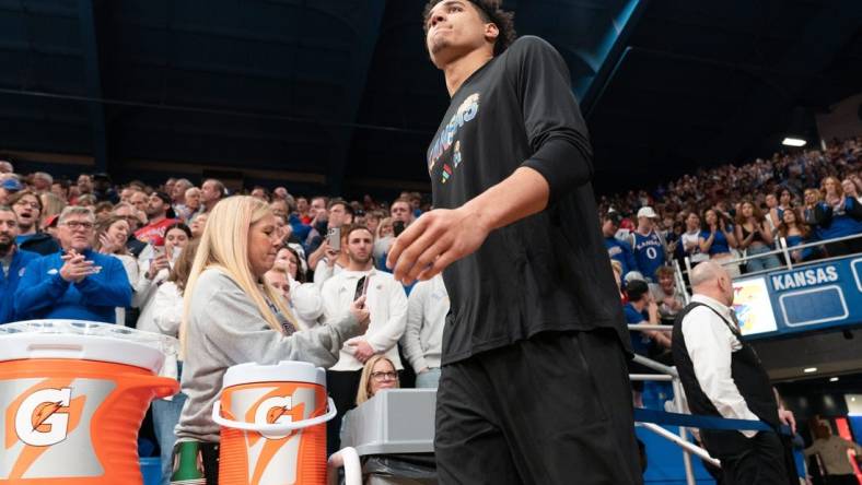 Kansas graduate senior guard Kevin McCullar Jr. (15) walks on to the court before the Jayhawks take on Baylor inside Allen Fieldhouse Saturday, February 10, 2024. McCullar did not play due to injury.