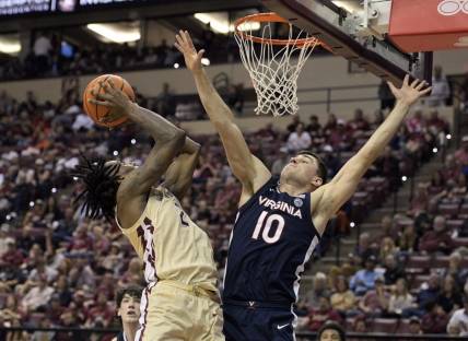 Feb 10, 2024; Tallahassee, Florida, USA; Virginia Cavaliers guard Taine Murray (10) defends the shot of Florida State Seminoles forward Jamir Watkins (2) during the second half at Donald L. Tucker Center. Mandatory Credit: Melina Myers-USA TODAY Sports