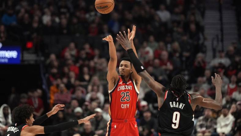 Feb 10, 2024; Portland, Oregon, USA; New Orleans Pelicans shooting guard Trey Murphy III (25) shoots the ball over Portland Trail Blazers small forward Jerami Grant (9) during the first half at Moda Center. Mandatory Credit: Soobum Im-USA TODAY Sports