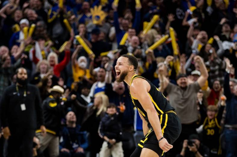 Feb 10, 2024; San Francisco, California, USA; Golden State Warriors guard Stephen Curry (30) reacts after hitting a three-ppont shot in the last second against the Phoenix Suns during the second half at Chase Center. Mandatory Credit: John Hefti-USA TODAY Sports