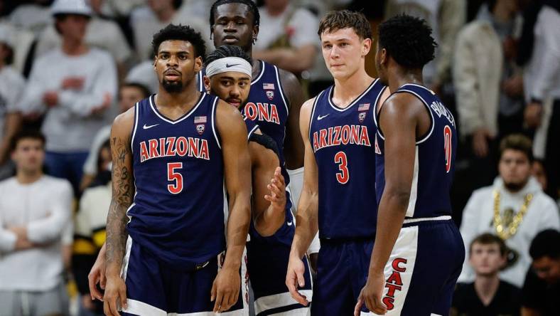 Feb 10, 2024; Boulder, Colorado, USA; Arizona Wildcats guard KJ Lewis (5) and guard Kylan Boswell (4) and center Oumar Ballo (11) and guard Pelle Larsson (3) and guard Jaden Bradley (0) in the first half against the Colorado Buffaloes at CU Events Center. Mandatory Credit: Isaiah J. Downing-USA TODAY Sports