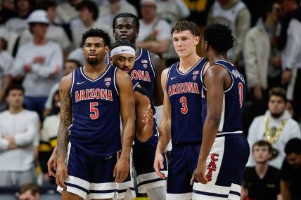 Feb 10, 2024; Boulder, Colorado, USA; Arizona Wildcats guard KJ Lewis (5) and guard Kylan Boswell (4) and center Oumar Ballo (11) and guard Pelle Larsson (3) and guard Jaden Bradley (0) in the first half against the Colorado Buffaloes at CU Events Center. Mandatory Credit: Isaiah J. Downing-USA TODAY Sports