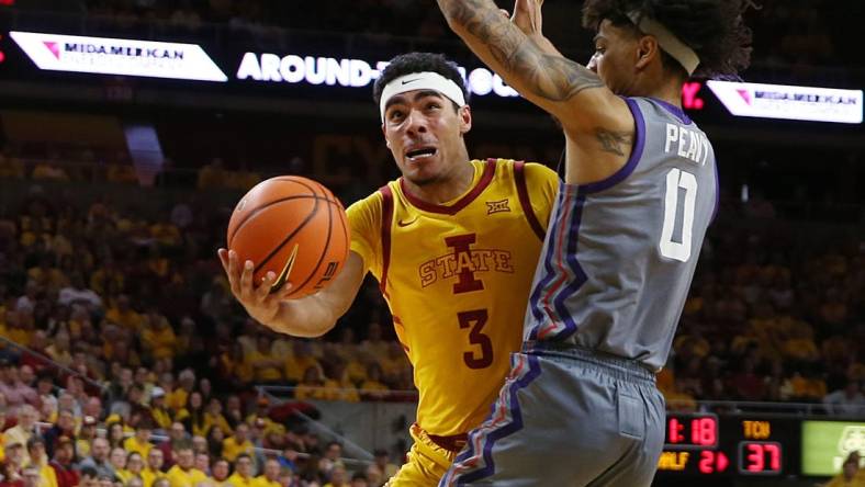 Iowa State Cyclones guard Tamin Lipsey (3) lays up the ball around TCU Horned Frogs guard Micah Peavy (0) during the second half in the Big-12 conference showdown of a NCAA college basketball at Hilton Coliseum on Saturday, Feb. 10, 2024, in Ames, Iowa.