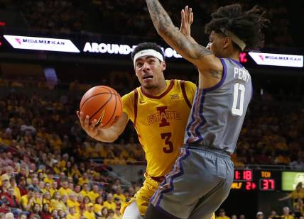 Iowa State Cyclones guard Tamin Lipsey (3) lays up the ball around TCU Horned Frogs guard Micah Peavy (0) during the second half in the Big-12 conference showdown of a NCAA college basketball at Hilton Coliseum on Saturday, Feb. 10, 2024, in Ames, Iowa.