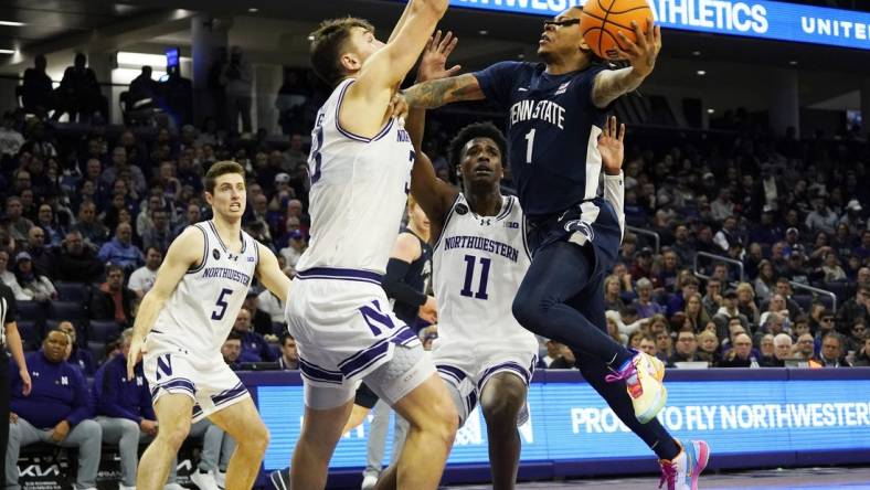 Feb 11, 2024; Evanston, Illinois, USA; Northwestern Wildcats forward Luke Hunger (33) defends Penn State Nittany Lions guard Ace Baldwin Jr. (1) during the first half at Welsh-Ryan Arena. Mandatory Credit: David Banks-USA TODAY Sports
