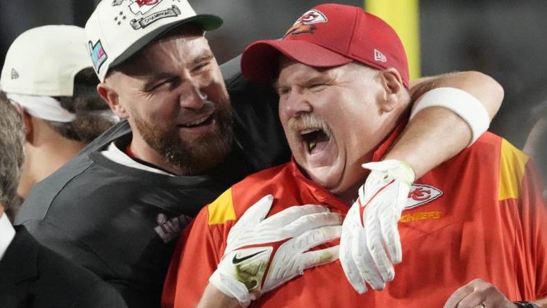 Chiefs coach Andy Reid celebrates on the podium with tight end Travis Kelce, left, after Kansas City defeated the Eagles in Super Bowl 57 at State Farm Stadium in Glendale, Arizona on Feb. 12, 2023.