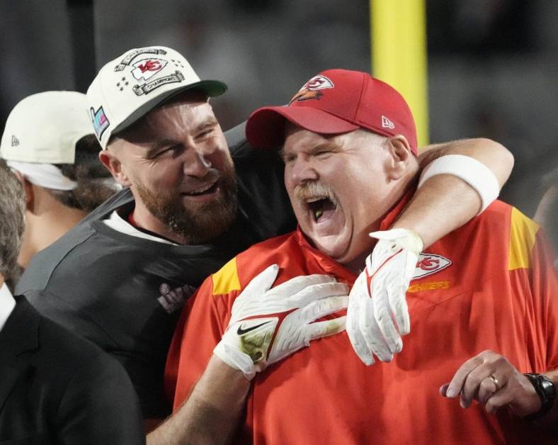 Chiefs coach Andy Reid celebrates on the podium with tight end Travis Kelce, left, after Kansas City defeated the Eagles in Super Bowl 57 at State Farm Stadium in Glendale, Arizona on Feb. 12, 2023.