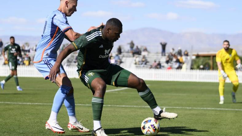 Feb 10, 2024; Indio, CA, USA; Portland Timbers defender Kamal Miller (4) moves the ball while New York City FC forward Hannes Wolf (17) defends at Empire Polo Club. Mandatory Credit: Kelvin Kuo-USA TODAY Sports